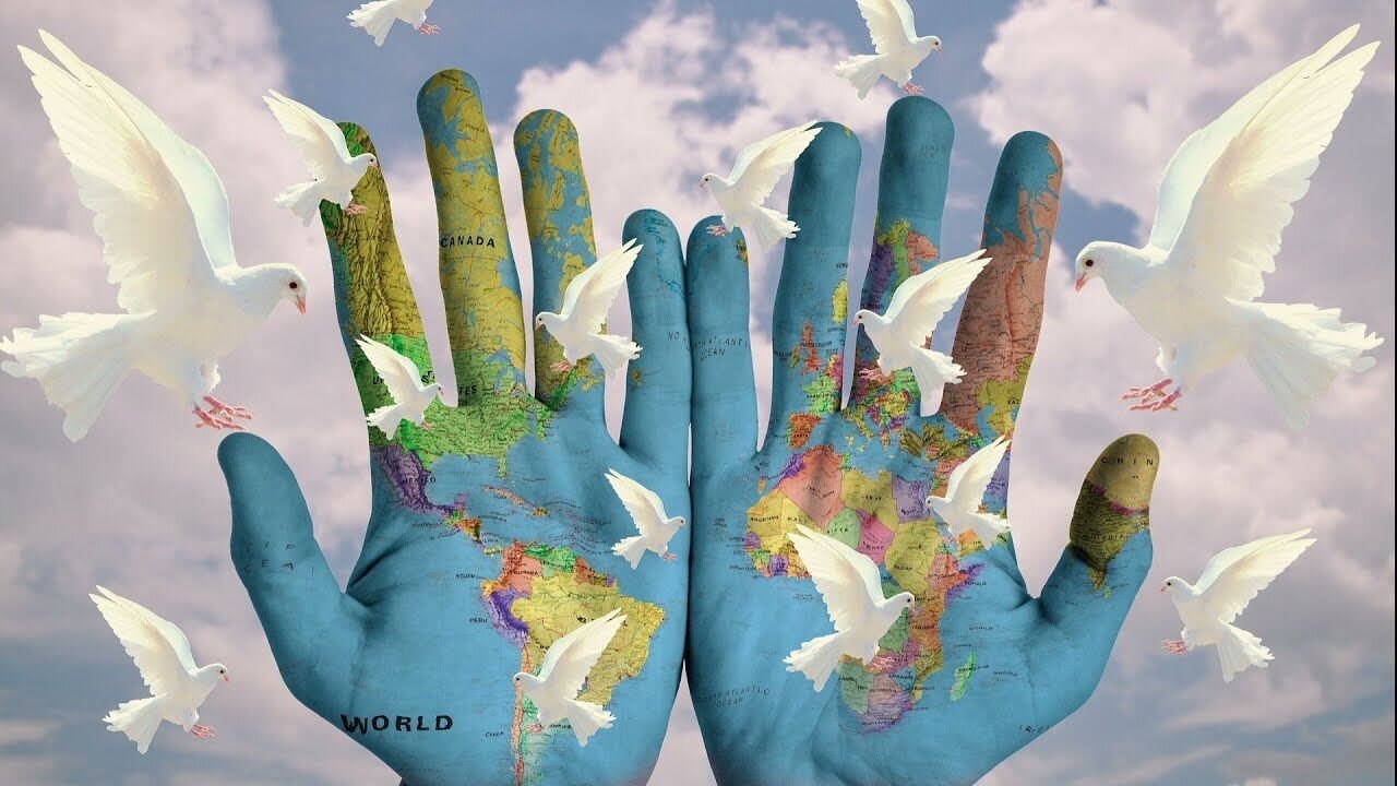 Two hands holding the Earth for the International Day of Peace